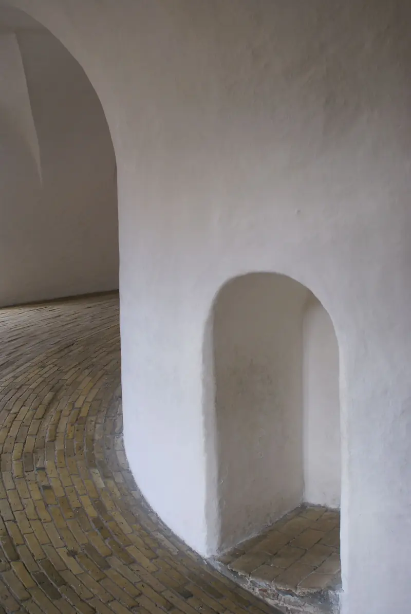 Soft plaster archways in warm daylight